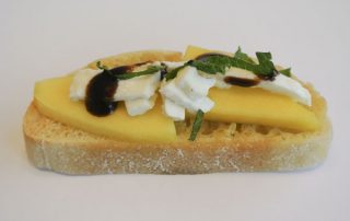 Bruschetta with mango, mozzarella and mint