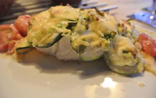 Oven dish with codfish and zucchini