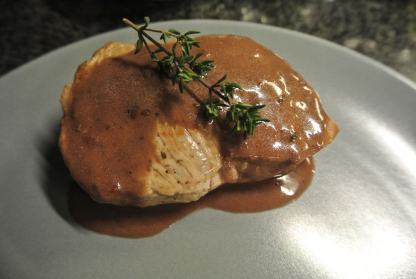 Escalope with red wine and orange sauce