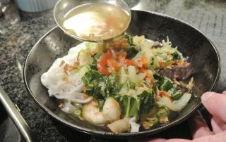 Noodle soup with steak and shrimps