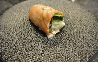 Salmon rolls with spinach and fresh herbs