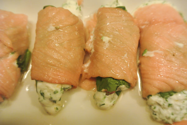 Salmon rolls with spinach and fresh herbs