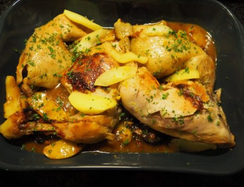 Chicken legs with cider, apple and plums